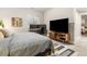 Bedroom with neutral paint, desk, computer monitors, and comfortable bedding at 997 Brocade Dr, Highlands Ranch, CO 80126