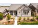 Well-manicured front yard and tasteful landscaping highlight this charming home's appealing exterior at 997 Brocade Dr, Highlands Ranch, CO 80126