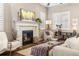 Cozy living room with fireplace and hardwood floors at 997 Brocade Dr, Highlands Ranch, CO 80126