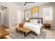 Spacious main bedroom with large windows and a stylish rug at 997 Brocade Dr, Highlands Ranch, CO 80126