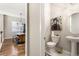 Stylish powder room with modern vanity and toilet at 997 Brocade Dr, Highlands Ranch, CO 80126