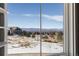 Open view of neighborhood and mountains from window at 997 Brocade Dr, Highlands Ranch, CO 80126