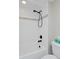 Close-up of a well-maintained bathroom showcasing a white tiled shower and modern fixtures at 2729 W 28Th Ave # 302, Denver, CO 80211