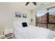 Comfortable bedroom with a ceiling fan, large window with natural light, and neutral decor for a calming space at 2729 W 28Th Ave # 302, Denver, CO 80211