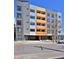 Modern apartment building featuring gray tones and orange accents at 2729 W 28Th Ave # 302, Denver, CO 80211