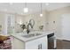Beautiful kitchen with a large island, stainless steel appliances, and an open concept layout to the living area at 2729 W 28Th Ave # 302, Denver, CO 80211