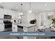Bright, open kitchen featuring stainless steel appliances, a large island, and ample cabinet space at 2729 W 28Th Ave # 302, Denver, CO 80211