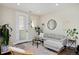 Cozy living room with modern decor, a comfortable gray sofa, and a stylish area rug at 2729 W 28Th Ave # 302, Denver, CO 80211