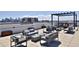 Expansive rooftop terrace featuring stylish seating arrangements and panoramic city views for outdoor entertaining at 2729 W 28Th Ave # 302, Denver, CO 80211