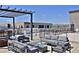 Relax on this spacious rooftop deck with stylish lounge furniture and views at 2729 W 28Th Ave # 302, Denver, CO 80211