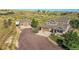 Expansive aerial view of the property featuring a large lot, detached garage, and beautiful surroundings at 2351 Sagebrush St, Parker, CO 80138