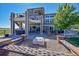 Expansive backyard featuring a patio, hot tub, and stone benches, perfect for outdoor entertaining at 2351 Sagebrush St, Parker, CO 80138