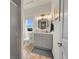 Well-lit bathroom featuring a modern vanity, stylish mirror, and a glass-enclosed shower at 2351 Sagebrush St, Parker, CO 80138