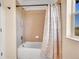 Bathroom featuring a tub and shower combination with tiled wall and floral curtain at 2351 Sagebrush St, Parker, CO 80138