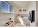 Bright bathroom featuring a relaxing soaking tub and a large window at 2351 Sagebrush St, Parker, CO 80138