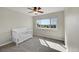 Cozy bedroom with a neutral color palette, ceiling fan, and outside view at 2351 Sagebrush St, Parker, CO 80138