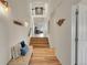 Bright foyer with hardwood floors, decorative lighting, and a staircase leading to the upper level at 2351 Sagebrush St, Parker, CO 80138