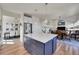 Kitchen island with open floor plan and a combination of a dining and living space at 2351 Sagebrush St, Parker, CO 80138