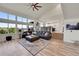 Bright living room with large windows, hardwood floors, and an open floor plan at 2351 Sagebrush St, Parker, CO 80138