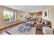 Cozy living room with large sectional sofa and large windows for natural light at 2351 Sagebrush St, Parker, CO 80138