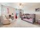 Bedroom featuring bunk beds, a sitting chair, and ample space for activities at 4885 S Algonquian Way, Aurora, CO 80016