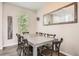 Bright dining area featuring a large table, wood floors, and a window offering natural light at 4885 S Algonquian Way, Aurora, CO 80016