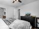 Bedroom featuring a ceiling fan, television, and a dresser at 9771 Mayfair St # F, Englewood, CO 80112