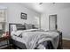 Bedroom features natural light, hardwood floors, and neutral walls at 9771 Mayfair St # F, Englewood, CO 80112
