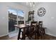 Inviting dining area with a wooden table, chairs, and sliding glass doors leading to the patio at 9771 Mayfair St # F, Englewood, CO 80112