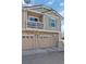 Two-story home with a two-car garage and stone accents at 9771 Mayfair St # F, Englewood, CO 80112