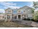 Attractive townhome exterior featuring stone accents and well-maintained landscaping at 9771 Mayfair St # F, Englewood, CO 80112