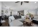 Open concept living and dining area with modern decor and kitchen view at 9771 Mayfair St # F, Englewood, CO 80112
