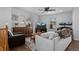 Cozy living room with comfortable seating, ceiling fan, and natural light at 9771 Mayfair St # F, Englewood, CO 80112