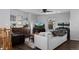 Cozy living room with hardwood floors, a comfortable sofa, and a TV for entertainment at 9771 Mayfair St # F, Englewood, CO 80112