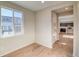 Bright room with light hardwood flooring and a large window at 23970 E 41St Ave, Aurora, CO 80019