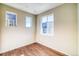 Bedroom with hardwood floors, two windows providing ample natural light at 23970 E 41St Ave, Aurora, CO 80019