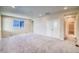Expansive living area featuring carpet flooring, and bright natural light at 23970 E 41St Ave, Aurora, CO 80019