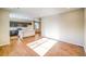 Open-concept living area showcasing hardwood floors, recessed lighting, and a view of the kitchen at 23970 E 41St Ave, Aurora, CO 80019