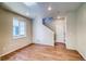 Cozy living room featuring hardwood floors, recessed lighting, and a staircase leading to the upper level at 23970 E 41St Ave, Aurora, CO 80019
