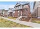 Attractive two-story home with brick accents and a welcoming front porch at 82 Oneida St, Denver, CO 80230