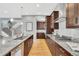 Gourmet kitchen featuring granite counters and stainless steel appliances at 82 Oneida St, Denver, CO 80230