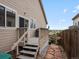 Back deck and access to backyard. The stairs lead down to a stone walkway at 8240 Clayton Ct, Denver, CO 80229