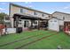 A beautiful backyard features a gazebo, lush grass, and a storage shed at 8240 Clayton Ct, Denver, CO 80229