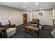 Basement with comfortable seating, neutral paint, and carpet and good lighting at 8240 Clayton Ct, Denver, CO 80229