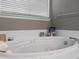 Inviting soaking tub featuring a neutral color palette and ample natural light at 8240 Clayton Ct, Denver, CO 80229