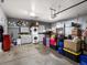 Garage area with washer and dryer with storage shelves and laundry area at 8240 Clayton Ct, Denver, CO 80229