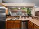 Lovely kitchen featuring a stainless steel sink and wooden cabinets at 8240 Clayton Ct, Denver, CO 80229