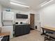 Functional laundry area includes gray cabinets, stacked washer/dryer, and a practical workspace at 8240 Clayton Ct, Denver, CO 80229
