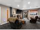 Cozy living room with a large TV, sliding glass doors, and comfortable seating, perfect for relaxation and entertainment at 8240 Clayton Ct, Denver, CO 80229