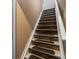 Unique staircase design with decorative stone risers and white painted stringers at 8240 Clayton Ct, Denver, CO 80229